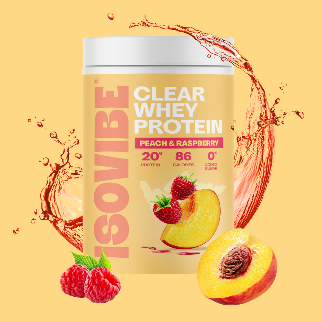 Peach and Raspberry ISOVIBE tub with water splashes and a half sliced peach and two raspberries in front of the tub