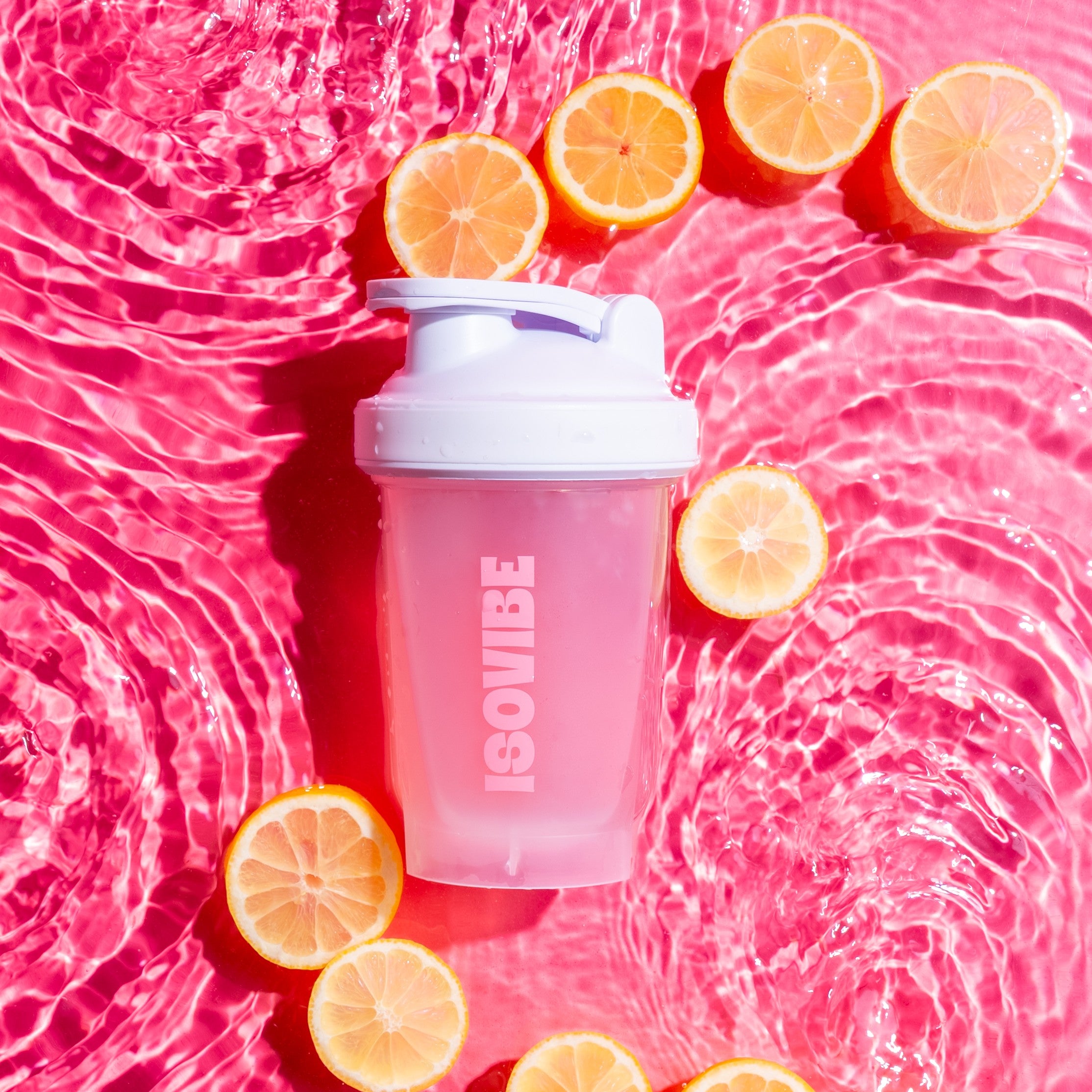 ISOVIBE shaker on bed of water and lemons
