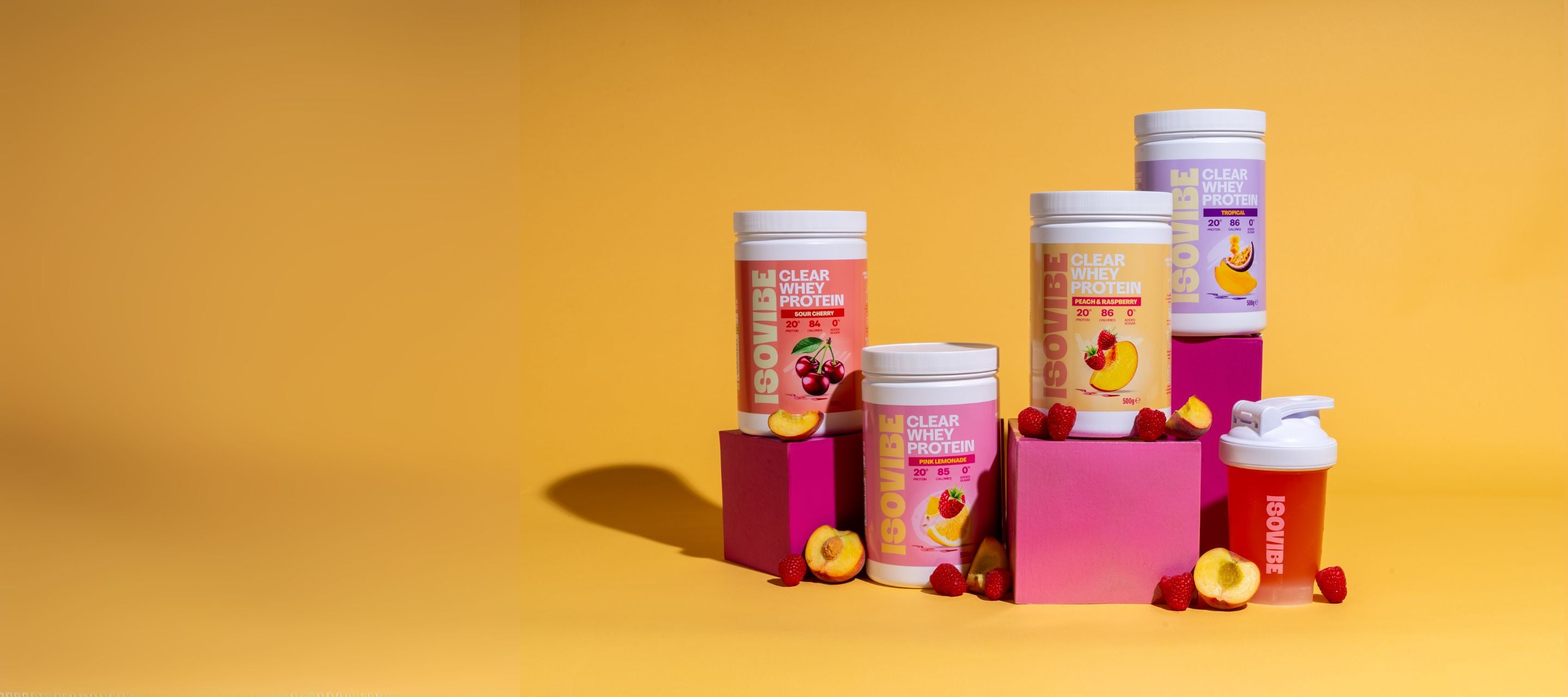 Range of ISOVIBE clear whey on a yellow background